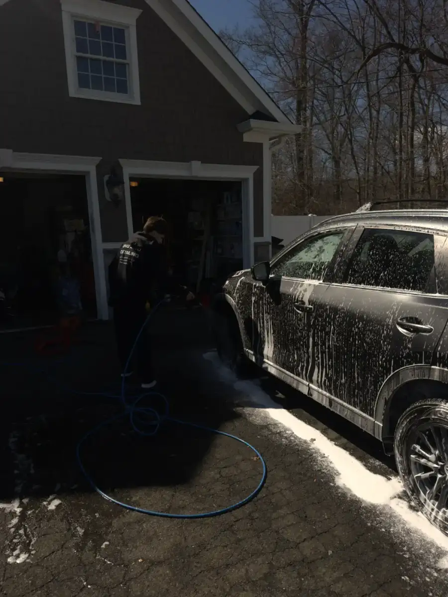 Christian power washing a vehicle exterior, GNG Auto Detail mobile detailing service NJ