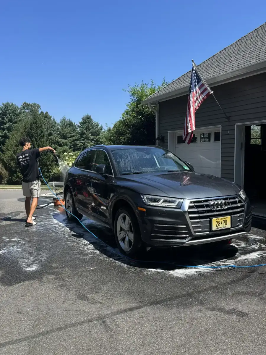 Mobile auto detailing near me. Justin power washing a vehicle exterior in Morris County