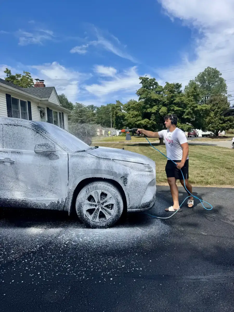 Nick rinsing off pre-wash foam
