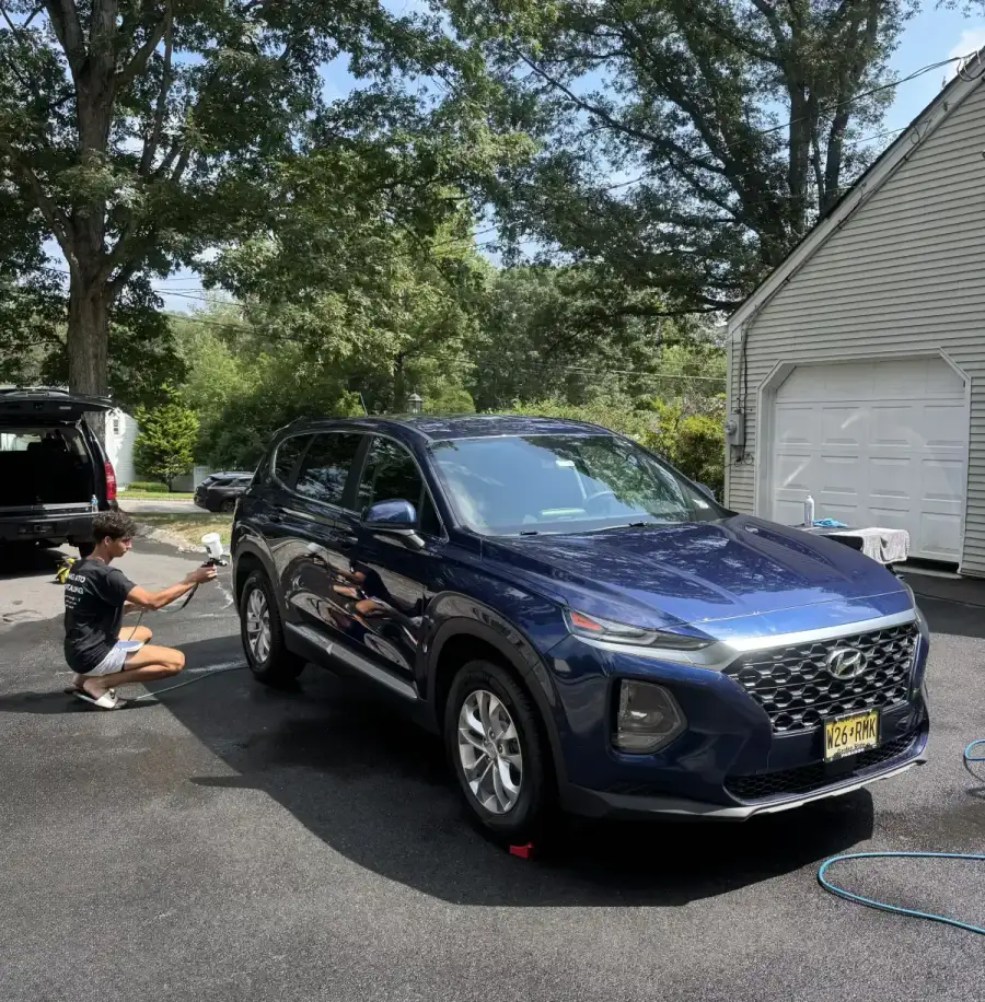 Justin applying tire dressing during a detail